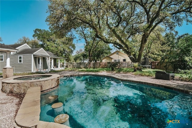view of pool featuring a fenced in pool, a storage structure, a fenced backyard, an in ground hot tub, and an outdoor structure