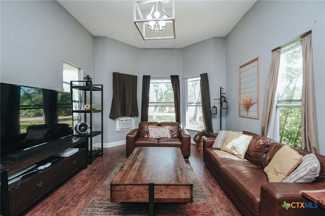 living room with baseboards, an inviting chandelier, dark wood-style floors, and cooling unit