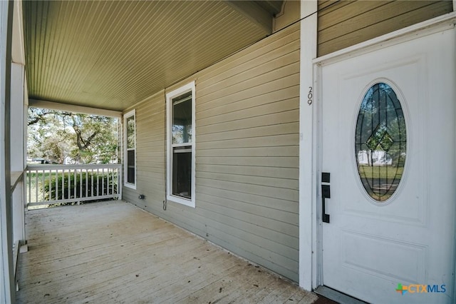 doorway to property with a porch