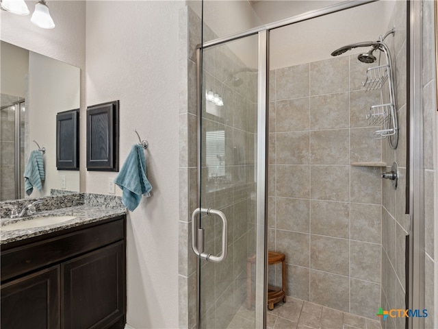 2136 Pioneer Pass, Seguin, TX 78155 - bathroom featuring vanity and a shower stall