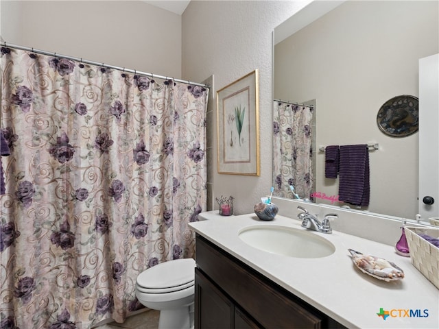 2136 Pioneer Pass, Seguin, TX 78155 - bathroom with vanity, toilet, curtained shower, and a textured wall
