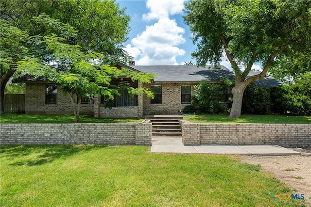 view of front of home with a front yard