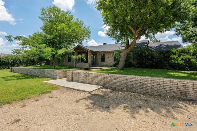 view of front of home with a front yard