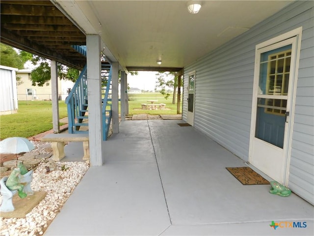 135 W Bayshore Dr, Palacios, TX 77465 - view of patio / terrace with stairway