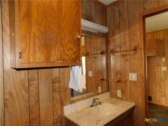 135 W Bayshore Dr, Palacios, TX 77465 - bathroom with wooden walls and vanity