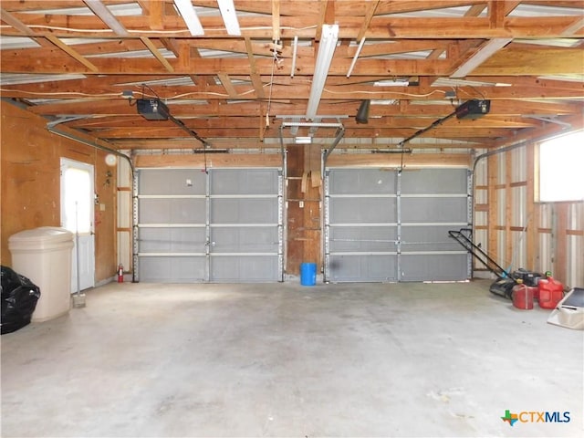 135 W Bayshore Dr, Palacios, TX 77465 - garage featuring a garage door opener