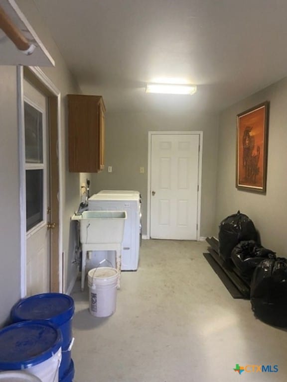 233 Thomas Dr, Martindale, TX 78655 - washroom featuring cabinet space, separate washer and dryer, and light carpet