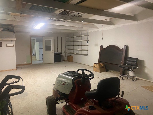 233 Thomas Dr, Martindale, TX 78655 - unfinished below grade area featuring freestanding refrigerator