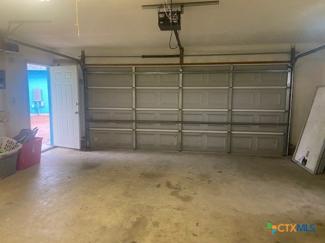 233 Thomas Dr, Martindale, TX 78655 - garage featuring a garage door opener