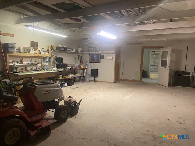 233 Thomas Dr, Martindale, TX 78655 - below grade area with a workshop area