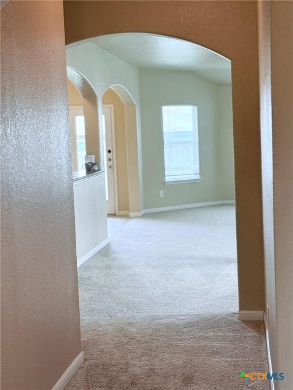 2602 Camp Cooper Dr, Killeen, TX 76549 - corridor featuring carpet flooring, arched walkways, and baseboards