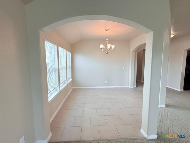 2602 Camp Cooper Dr, Killeen, TX 76549 - unfurnished dining area with vaulted ceiling, a chandelier, arched walkways, baseboards, and light tile patterned flooring