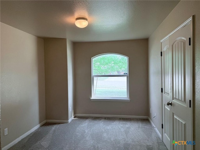 2602 Camp Cooper Dr, Killeen, TX 76549 - carpeted spare room with baseboards and a textured ceiling