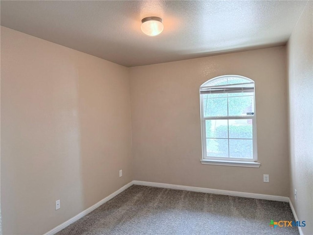 2602 Camp Cooper Dr, Killeen, TX 76549 - carpeted spare room with baseboards and a textured ceiling