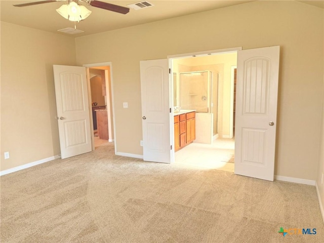 2602 Camp Cooper Dr, Killeen, TX 76549 - unfurnished bedroom featuring light carpet, baseboards, ensuite bathroom, and ceiling fan