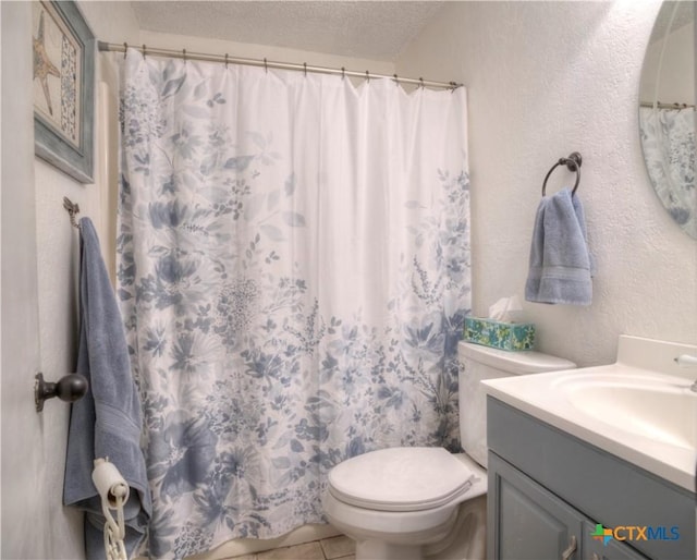 5110 Sam Houston, Temple, TX 76502 - full bath with a textured ceiling, vanity, tile patterned flooring, a textured wall, and a shower with curtain