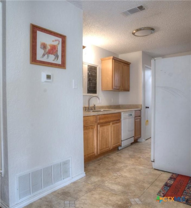 5110 Sam Houston, Temple, TX 76502 - kitchen with white appliances, a textured ceiling, and light countertops