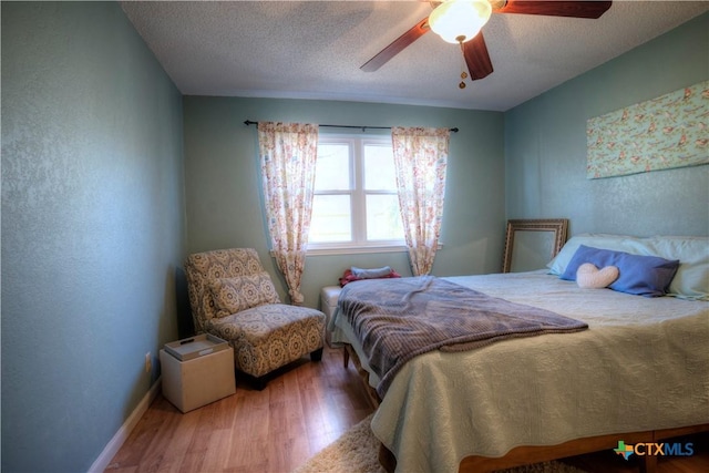5110 Sam Houston, Temple, TX 76502 - bedroom featuring wood finished floors, ceiling fan, and a textured ceiling