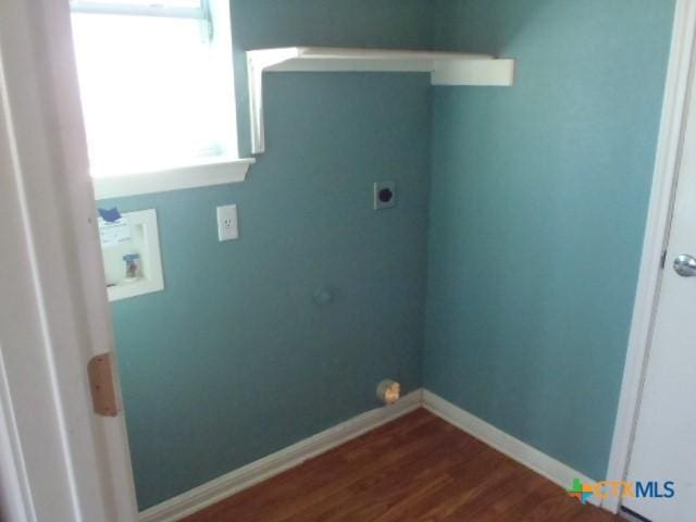 laundry room featuring hookup for an electric dryer, laundry area, washer hookup, baseboards, and dark wood finished floors