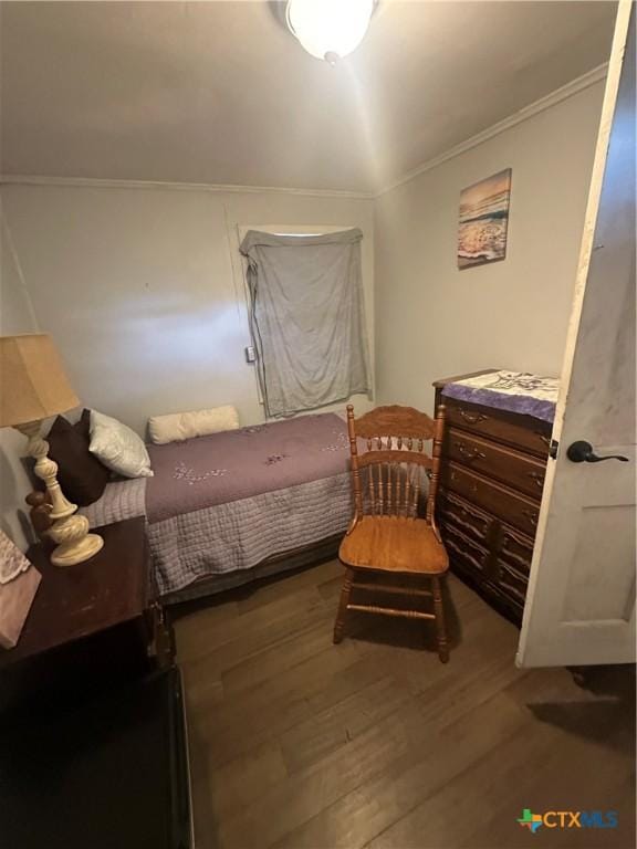 502 Tommy Dr, Port Lavaca, TX 77979 - bedroom with wood finished floors and crown molding