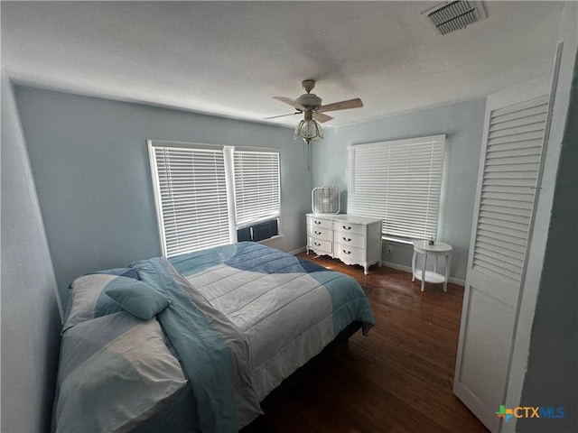 502 Tommy Dr, Port Lavaca, TX 77979 - bedroom featuring dark wood-type flooring and ceiling fan