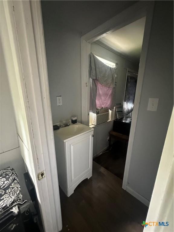 502 Tommy Dr, Port Lavaca, TX 77979 - hallway with a sink and dark wood finished floors