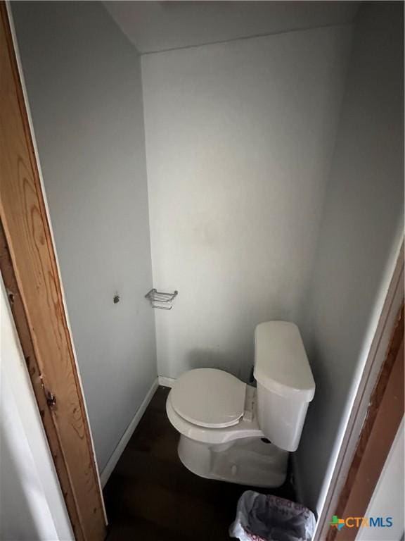 502 Tommy Dr, Port Lavaca, TX 77979 - bathroom featuring toilet and wood finished floors
