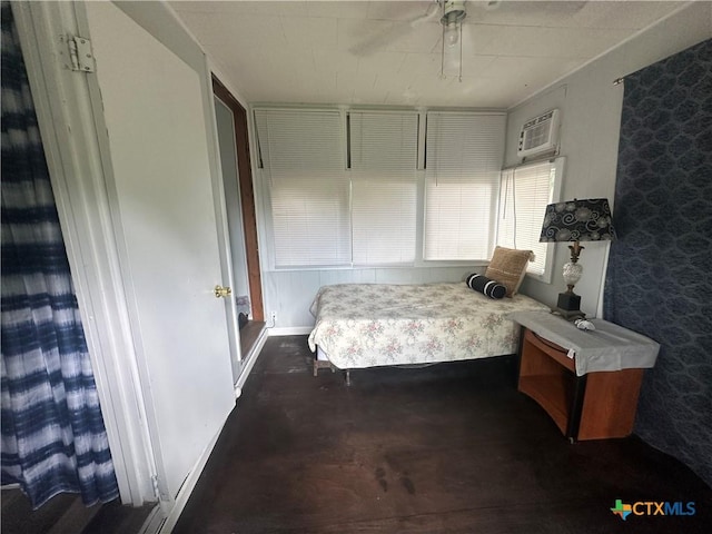 502 Tommy Dr, Port Lavaca, TX 77979 - bedroom with an AC wall unit and a ceiling fan