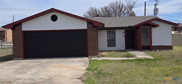 single story home featuring brick siding, a front lawn, fence, a garage, and driveway