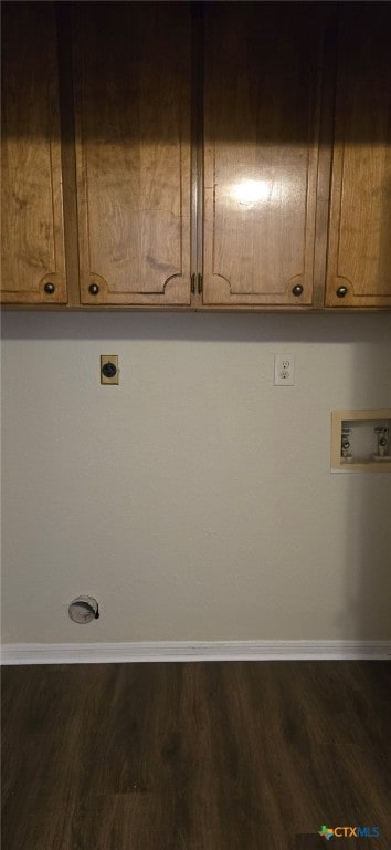 clothes washing area with hookup for a washing machine, wood finished floors, baseboards, cabinet space, and electric dryer hookup