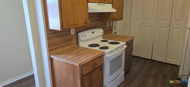 kitchen with light countertops, electric stove, brown cabinets, and under cabinet range hood