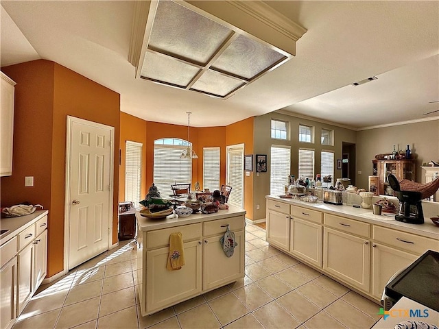 kitchen with light tile patterned floors, visible vents, and light countertops