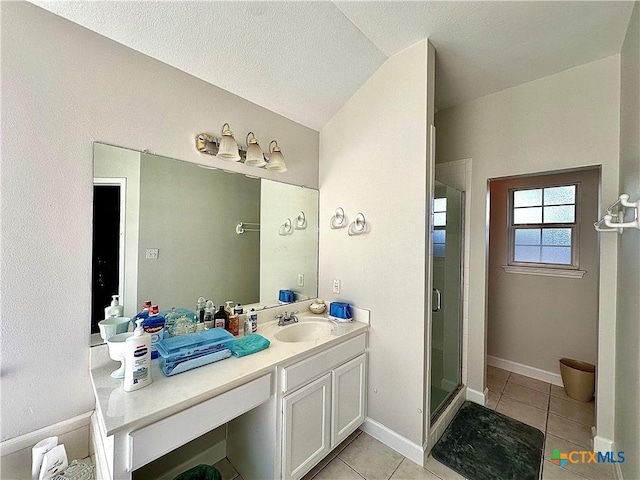 full bathroom featuring tile patterned floors, vanity, and a stall shower