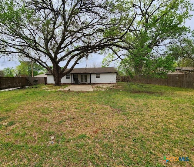 view of yard featuring a fenced backyard and a patio
