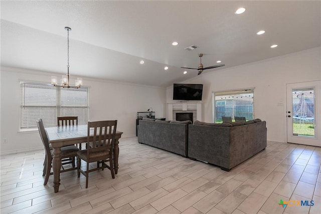 6106 Cactus Flower Ln, Killeen, TX 76549 - living area with crown molding, a chandelier, lofted ceiling, a fireplace, and recessed lighting