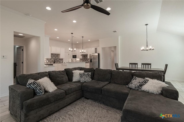 6106 Cactus Flower Ln, Killeen, TX 76549 - living room with a chandelier, ceiling fan, crown molding, and recessed lighting