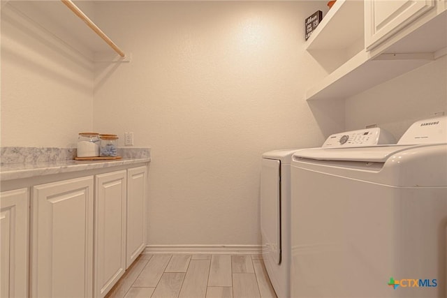 6106 Cactus Flower Ln, Killeen, TX 76549 - washroom featuring washer and dryer and cabinet space