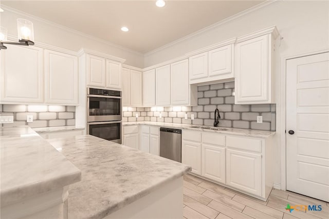 6106 Cactus Flower Ln, Killeen, TX 76549 - kitchen with stainless steel appliances, white cabinetry, ornamental molding, recessed lighting, and backsplash