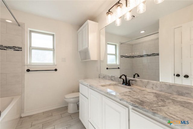 6106 Cactus Flower Ln, Killeen, TX 76549 - bathroom featuring vanity, washtub / shower combination, wood finish floors, and recessed lighting