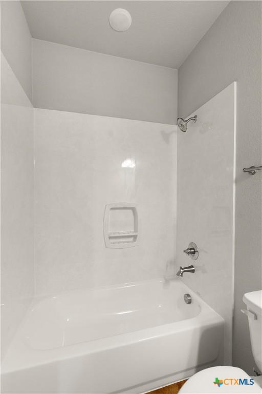 1402 Lindsey Dr, Copperas Cove, TX 76522 - bathroom featuring toilet and tub / shower combination