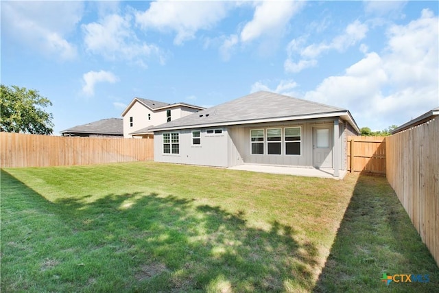 1402 Lindsey Dr, Copperas Cove, TX 76522 - back of property with a lawn, a patio, and a fenced backyard