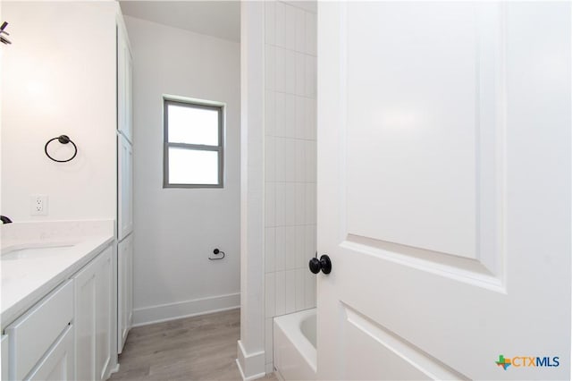 2002 Rosson St, Nolanville, TX 76559 - full bathroom with vanity, wood finished floors, and shower / washtub combination