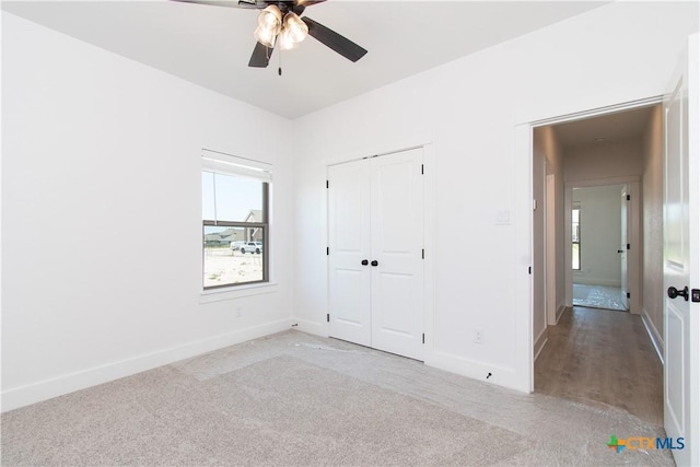 2002 Rosson St, Nolanville, TX 76559 - unfurnished bedroom featuring multiple windows, carpet, and a closet