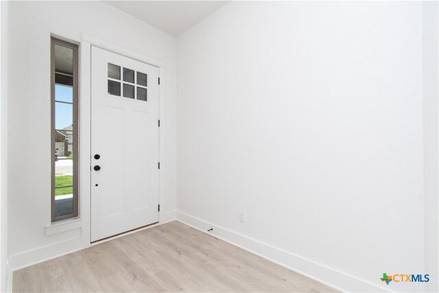 2002 Rosson St, Nolanville, TX 76559 - entryway with light wood-type flooring and baseboards