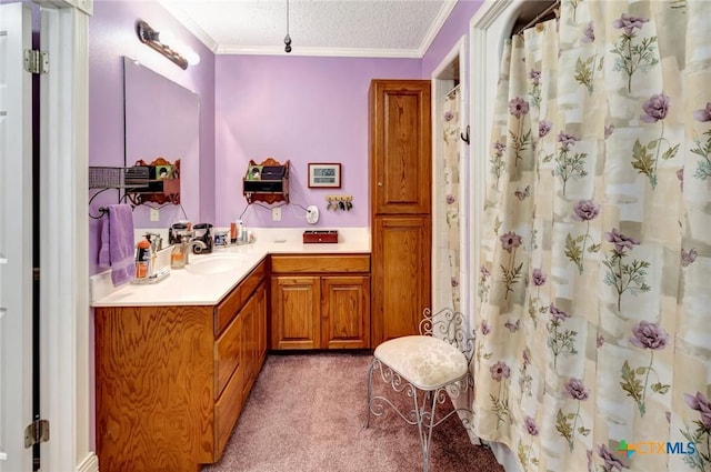 bathroom with vanity, ornamental molding, a textured ceiling, and walk in shower