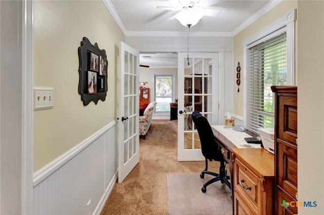 home office featuring light carpet, french doors, ceiling fan, and a textured ceiling