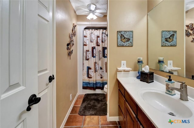 bathroom featuring ceiling fan, a shower with curtain, tile patterned flooring, toilet, and vanity