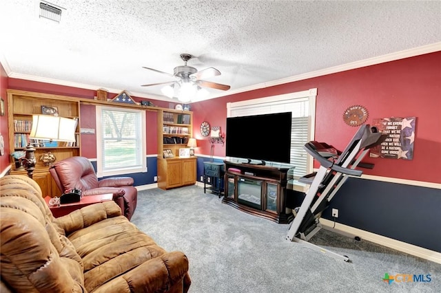 living room with light carpet, ornamental molding, a textured ceiling, ceiling fan, and a fireplace