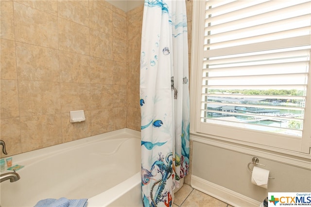 bathroom with shower / bath combo and tile patterned flooring