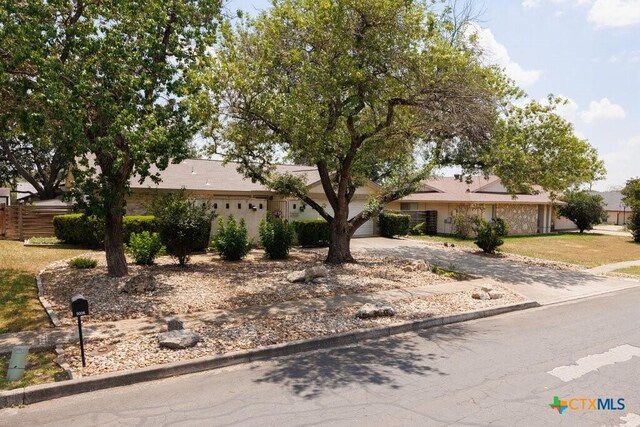 5006 Las Campanas St, San Antonio, TX 78233 - view of front of home featuring concrete driveway and a garage